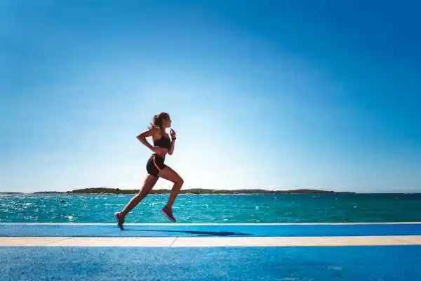Woman running showing strong leg muscle Barnsley